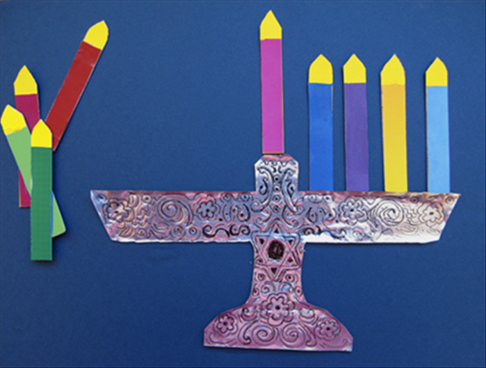 To make the menorah magnet toy you need:
Junk mail
Magnet advertisements
Foil lined package  -  cut opened and washed
White glue
Scissors

