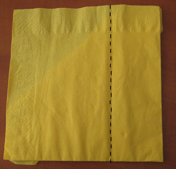 Flip the napkin over to the back side.
 Fold the right side1/3 of the way to the left
