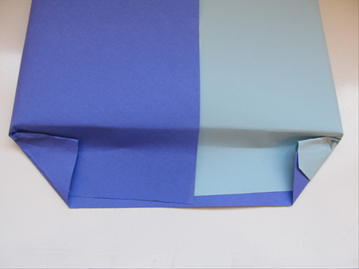 Fold the corners up to the present.
