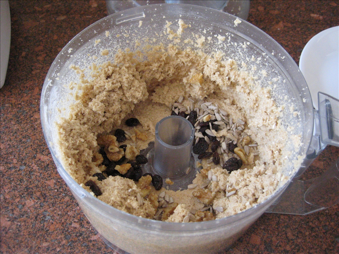 Stir in the raisins and seeds by hand