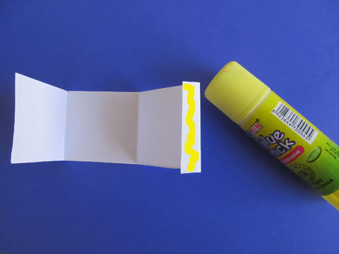 <p> Fold the tab and put glue on it.</p> 
<p>  </p>