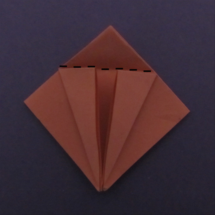 Fold the top point down along the edges of the flaps you just made. Unfold
Unfold the 2 flaps.