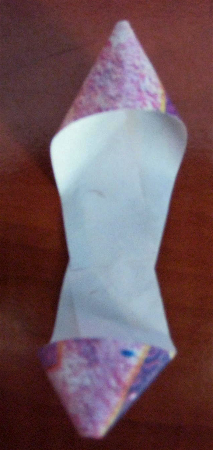Turn the paper around,  repeat the directions but align the end of the paper to the end of the other loop. 
Glue it in place
