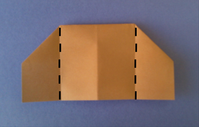 Flip the paper over and fold the left and right sides to the center crease