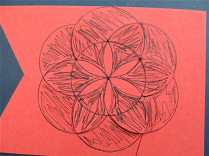 You can cut out the area around the center petal shapes for a thin flower or stamen.
(cut out the area colored in black)