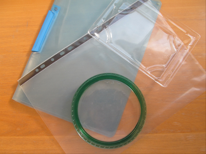 Find a flat see- through plastic object and cut out a strip from it.
 *Make sure it is plastic that does not stretch.
