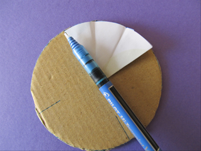 Fold the quarter circle into thirds and crease
Place it between the quarter lines
And mark on the edge of the cardboard where the paper’s thirds creases are
Repeat between all the quarter lines
