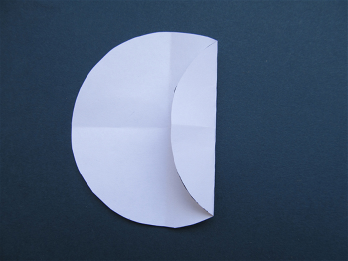 Fold the right side of the circle to the center.
Unfold
