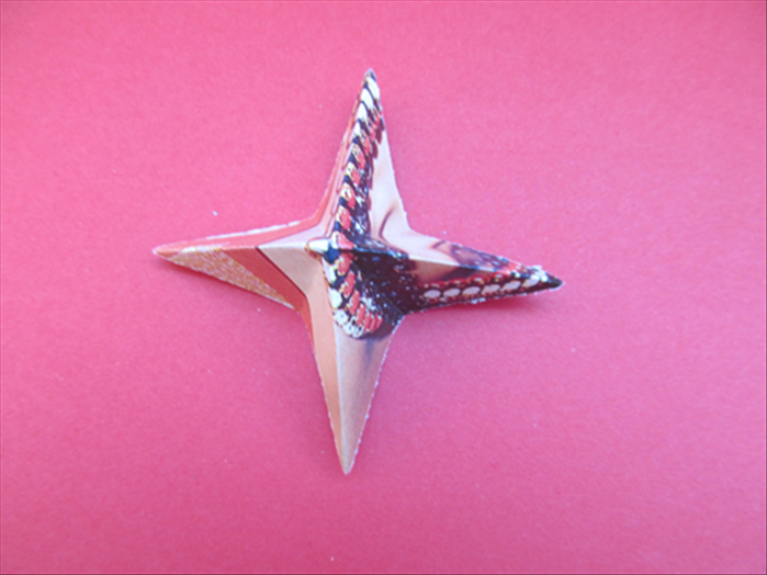 The result is a 4 pointed star.  *Notice that the other folds go inward.