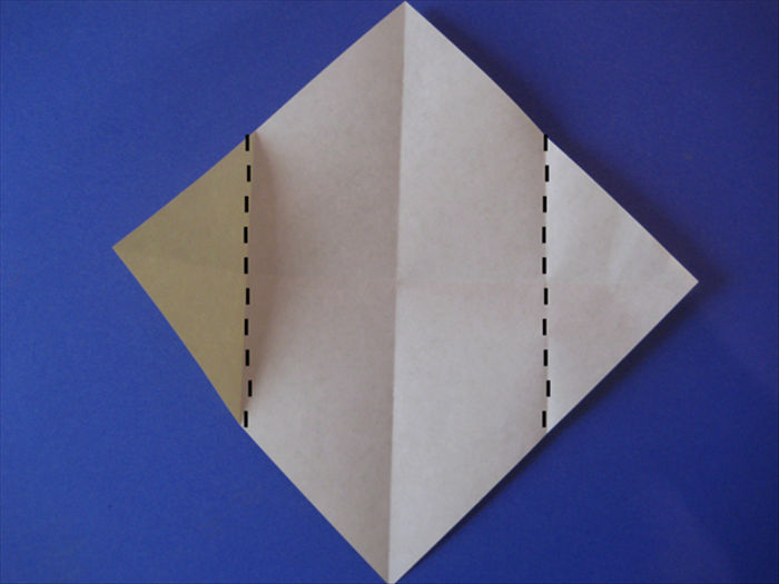 Fold the side points to the center crease
