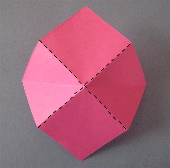 Flip paper over again

Pinch and squeese all the diagonal folds.
The horizontal folds will collapse inward.
