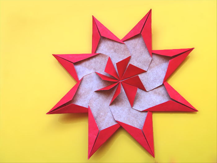 You will need:
8 rectangles of paper  the length twice the width - (for this guide I cut a shopping bag into 2 inches X 4 inches pieces to make a 8 inch wide star)
Paper glue
