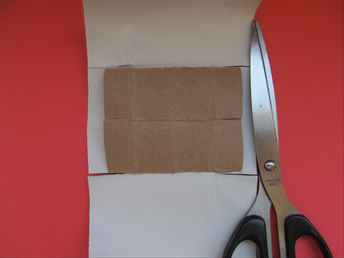 Use the slits in the box as a guide where to cut slits in the paper