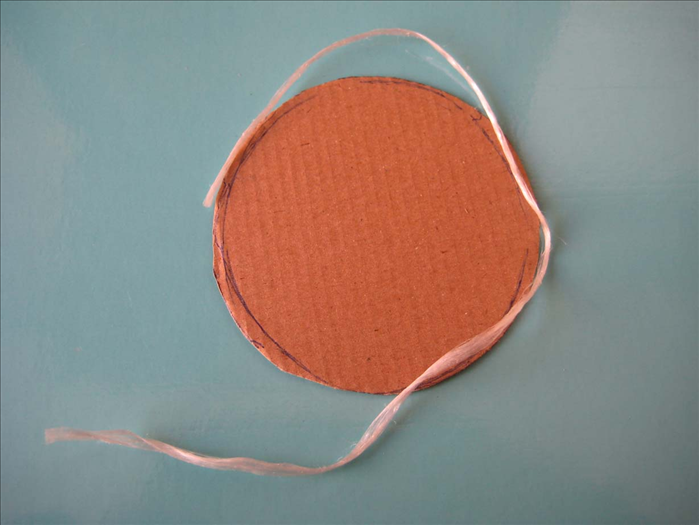 Measure the circle with a piece of string. Add 3/4 inch to the length and cut.