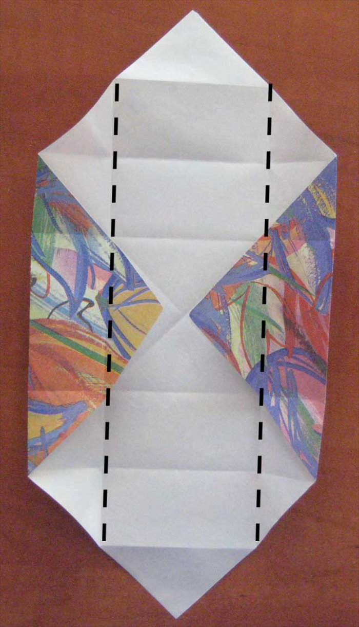 Open the top and bottom flaps
Fold the left and right sides to the center 
