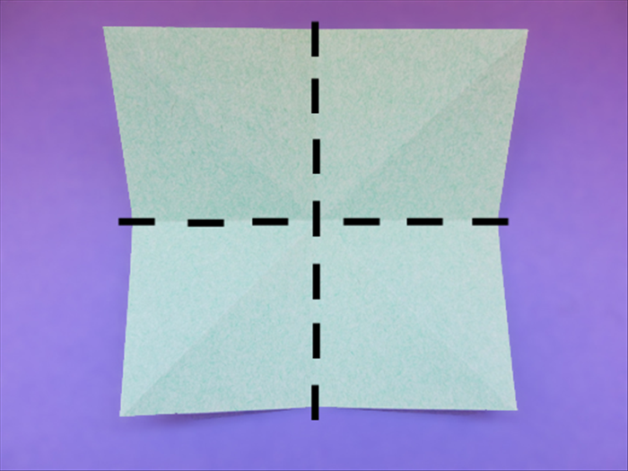<p> Flip the paper over to the back side.</p> 
<p> Fold the top and bottom edges together to fold it in half. Unfold.</p>  
<p> Fold the side edges together to fold it in half. Unfold.</p>  
<p>  </p>
