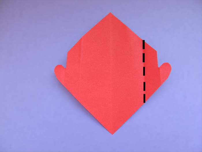 Unfold the paper
Fold the crease of the half heart shape to align with the center crease
