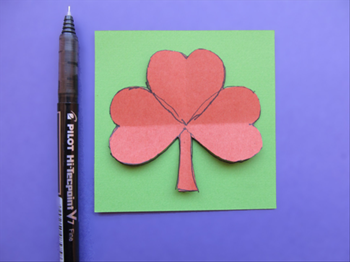 Trace around the outline of the clover shape on the paper you want to use for you shamrock