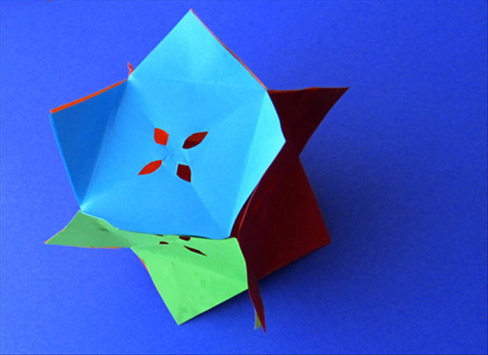 Materials:
6 equal sizes squares of colored paper 
Paper glue stick
Scissors
