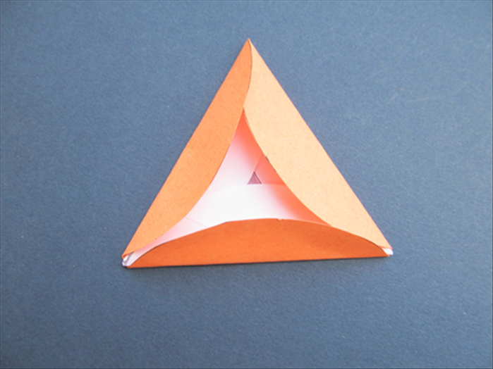 Fold the other 2 sides up over the edges of the triangle