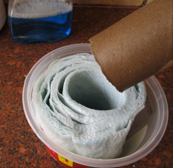 Turn the paper over to the other side and pour more liquid

Remove the cardboard roll