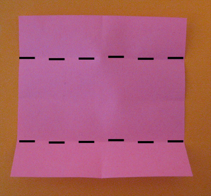  Fold the top and bottom edges to the center crease marks.
