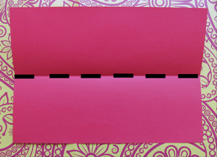 You can use ready envelopes or make your own. 
In this guide A4 sized paper was used but you can use any size.

To make a wide envelope fold your paper in half horizontally and unfold.

