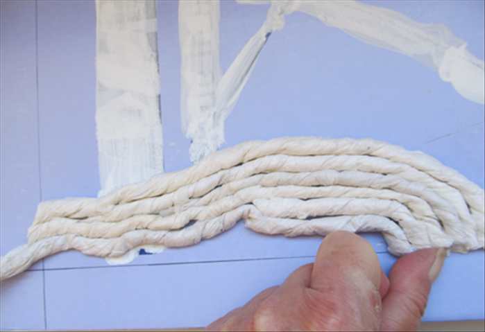 Continue cutting and gluing ropes to fill in the area.