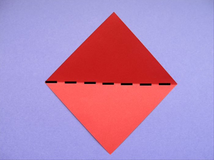 Place the paper with the points at the top, bottom and sides.

Bring the bottom point up to the top to fold it in half
Crease and unfold
