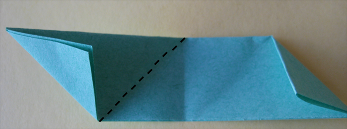 <p> Take the other paper and fold the left side down at the center crease.</p>