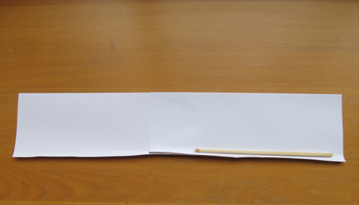 Use the chopstick to roll up the bottom edge of the paper. 
Do one side at a time and the middle to make a curl upwards.