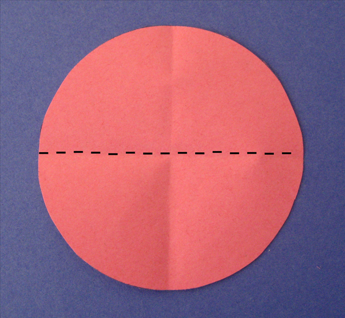 Rotate the circle and align the crease you just made to fold it in half again
