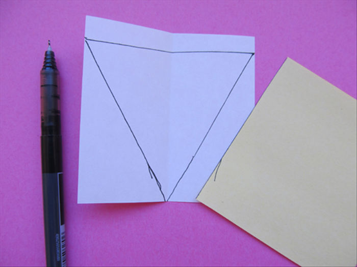<p> Use the straight edge to connect the dots with a line.</p> 
<p> Cut out the triangle</p> 
<p>  </p>