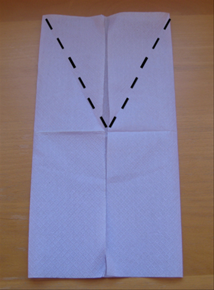 Fold the flaps you just made at an angle from the center down to the sides as shown in the picture.