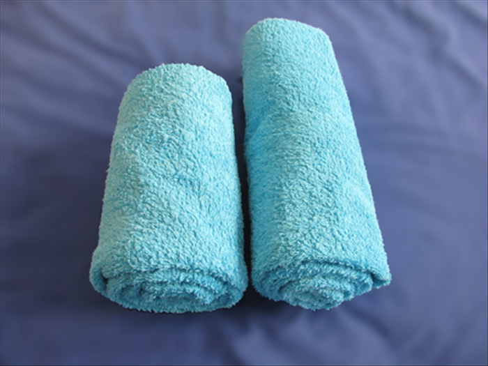 Here are the towels rolled up.
The short roll on the left was folded in thirds
The longer roll on the right was folded in half

