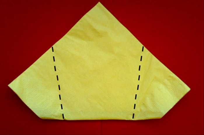 Flip the napkin over to the back side.
Fold the side points to meet at the center.