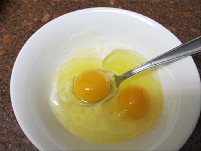 Beat together the melted margarine and eggs