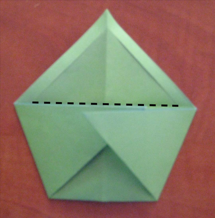 Unfold the the last fold.
 Flip the paper back over  so that the long edge is at the bottom and refold the sides.
Fold  one layer of the cut shape down..
