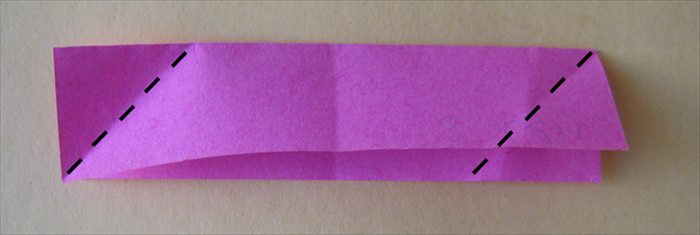 <p> Take one paper with the open side facing down. Fold the left corner down to the bottom edge. Fold the right corner up to the top edge.</p>