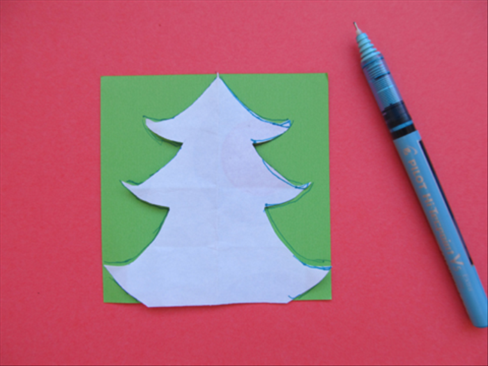 Unfold the template and trace the outline on the 2 green papers
Cut out the 2 trees
