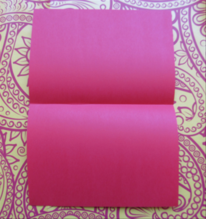 If you want to make an envelope that will be taller and less wide, hold the paper with the short edges at the top and bottom and repeat steps 12 to 15