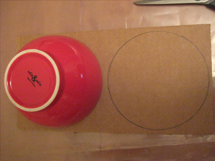 Find a circular object that is slightly smaller than your plate.

Trace 2 circles  on thick corrugated cardboard