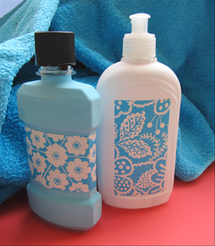 Materials:
Plastic bottles from items you use in the bathroom
Decorative paper in colors that match the paint and your towels or other color accents you have in the bathroom. 
Glue
Leftover wall paint 
Paintbrush
Scissors

* The bottles used in this guide are from liquid soap and mouthwash
