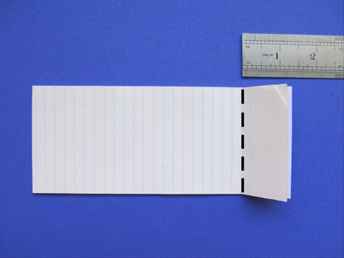 Align all the papers.
Fold 1 ¼ inches at the end of the note paper.