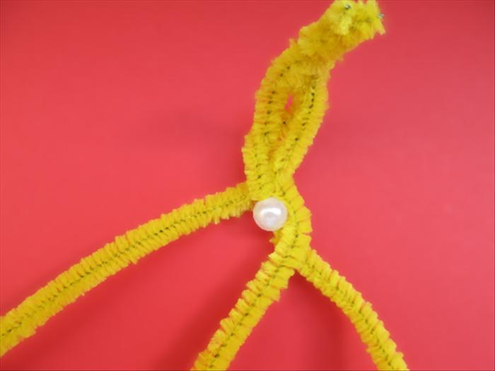 Bring the right pipe cleaner over to the left

It is now the middle one

