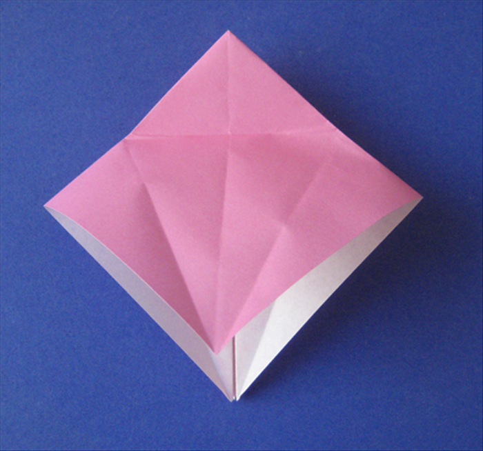 Unfold the flaps you just made in steps 2 to 4 and lift the top layer up