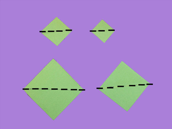 Place the 4 squares of paper with the points at the top, bottom and sides

Bring the tops and bottoms together to fold them in half.

