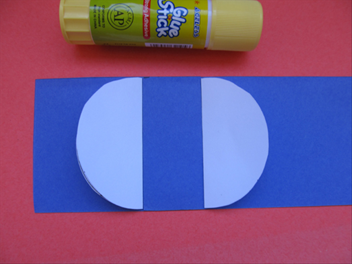 Align the straight edges of the folded circles to the sides of the piece you glued in the last step. Glue them in place.