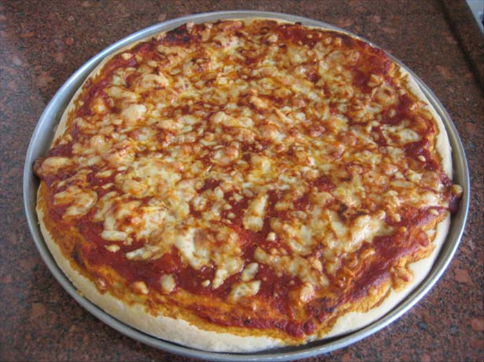 Ingredients for 2 large pizza pies :
1 medium onion chopped
2 cloves garlic crushed
1 tablespoon chopped fresh basil leaves or ½ teaspoon dried basil 
1 ½ teaspoons fresh oregano or ½ teaspoon dried oregano
¼ teaspoon black pepper
1 medium can tomato paste
2 cups shredded cheese – mozzarella is best but yellow cheese will do
¼ cup parmesan cheese – optional

For dough:
1 package dried active yeast
¾ cup warm water
½ teaspoon salt
½ teaspoon sugar
2 tablespoons olive oil  or vegetable oil
2 cups flour
