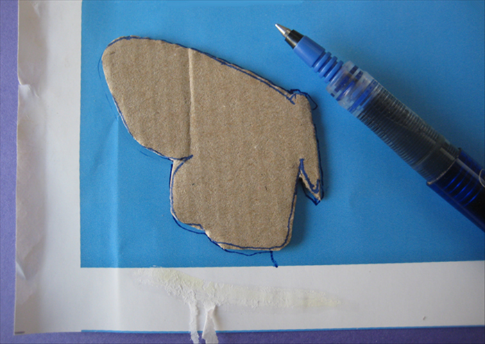 Cut out the cardboard shape.
Trace the shape on junk mail that has twice the length.
